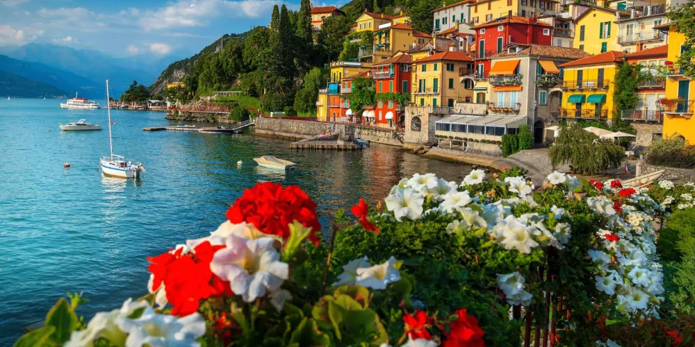 The lakeside promenade at Como with mountains rising behind the town